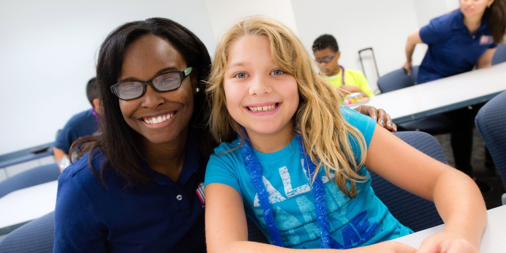 benefits employee sitting with a young girl